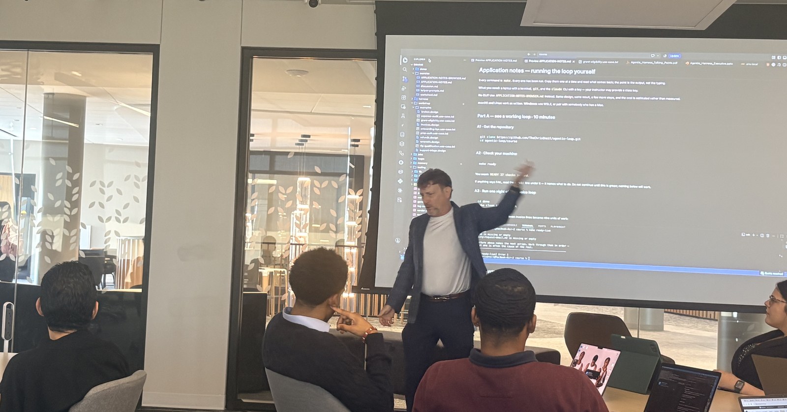 Chris O'Neil presenting the loop to business students at Wichita State University, with the course exercise notes on screen